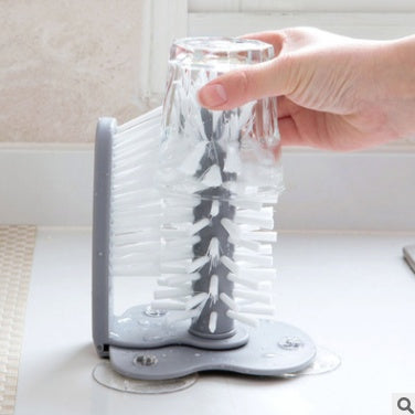 Suction cup brush cleaning bottle interior